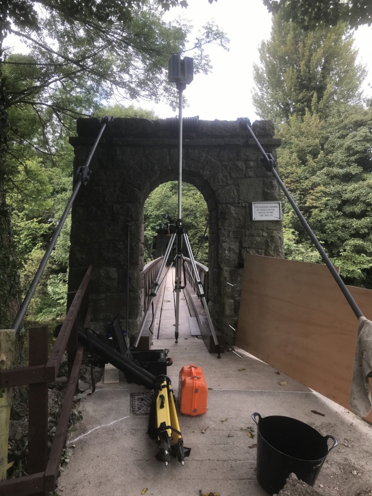 3D Scanner on elevated tripod infront of a bridge arch