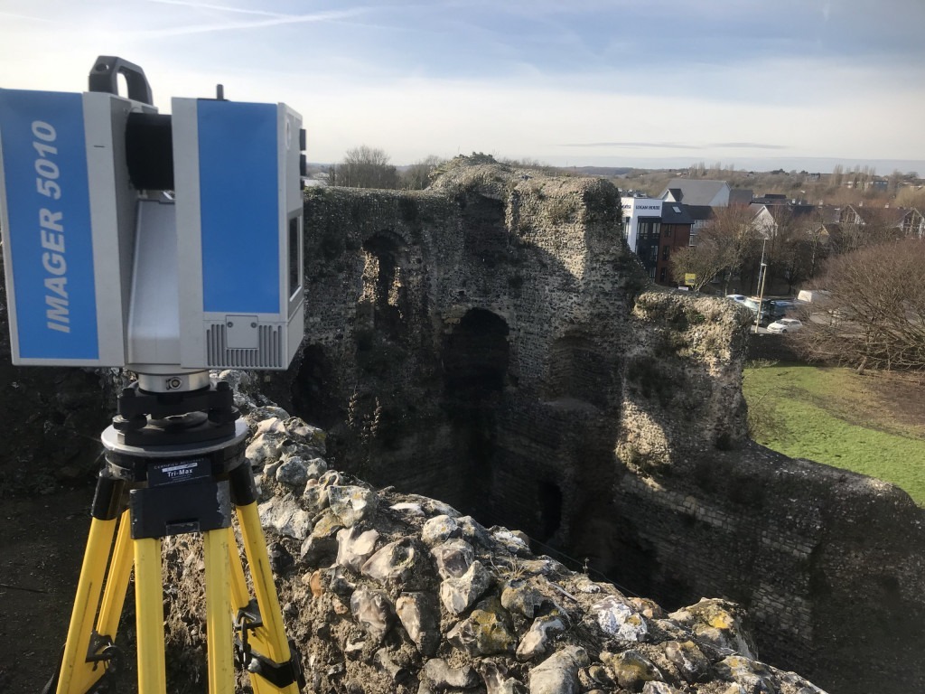 3D Scanner on top of a crumbly canterby castle with city rooftops in the back ground