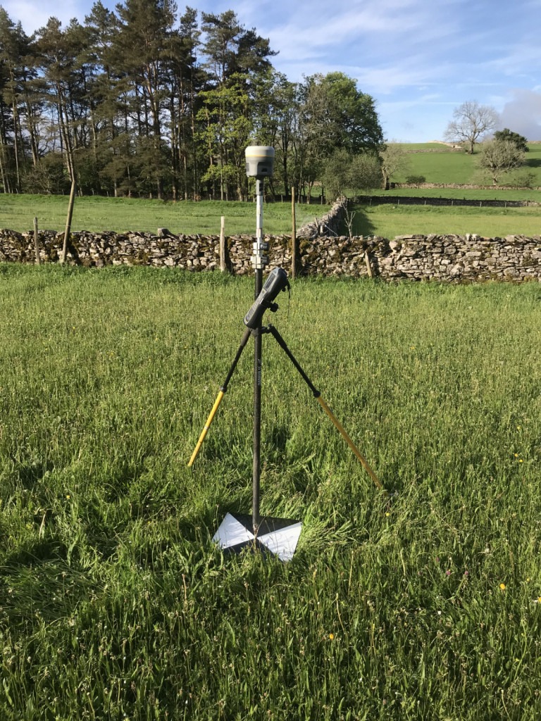Trimble GNSS R10 measuring drone survey ground control target in a field