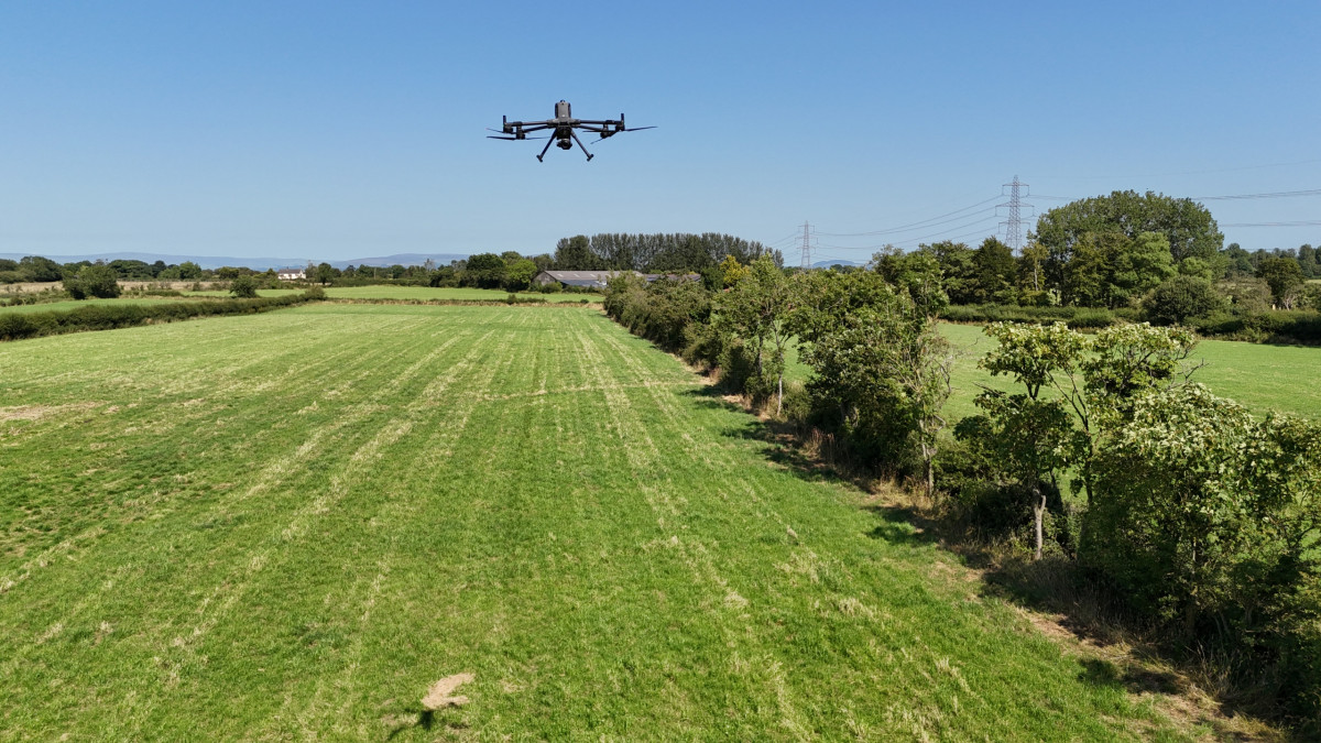 DJI Matrice 400 carrying out a drone survey over farmland