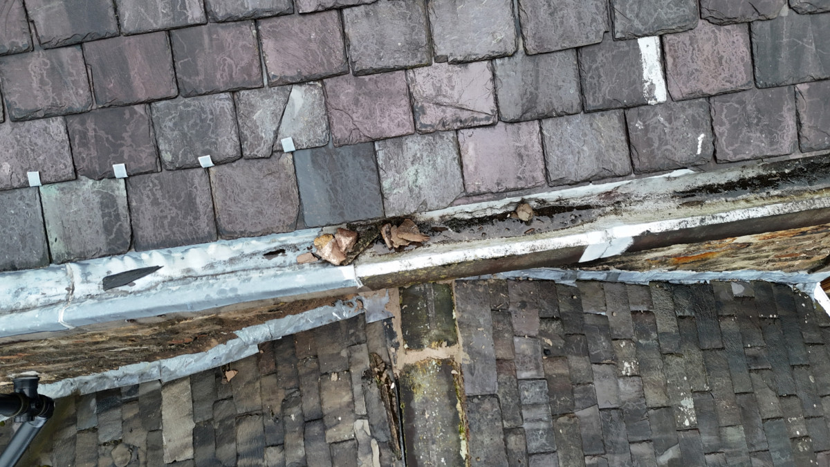 Drone roof inspection showing gutter, slates and leadwork